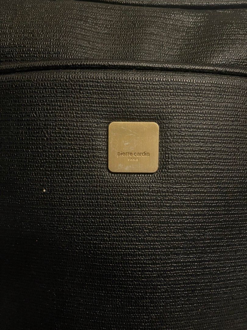 Pierre Cardin Black Textured Backpack (Category: Backpacks) located in General Trias. Submitted by laconchita_tesoros (Listing ID 1462947827, Image 2). Description: - Brand: Pierre Cardin - Color: Black - Material: Textured - Features: Main zippered compartment, front zippered pocket, adjustable shoulder straps, top handle - Ideal for: Daily use, travel Signs of used on zipper handle.