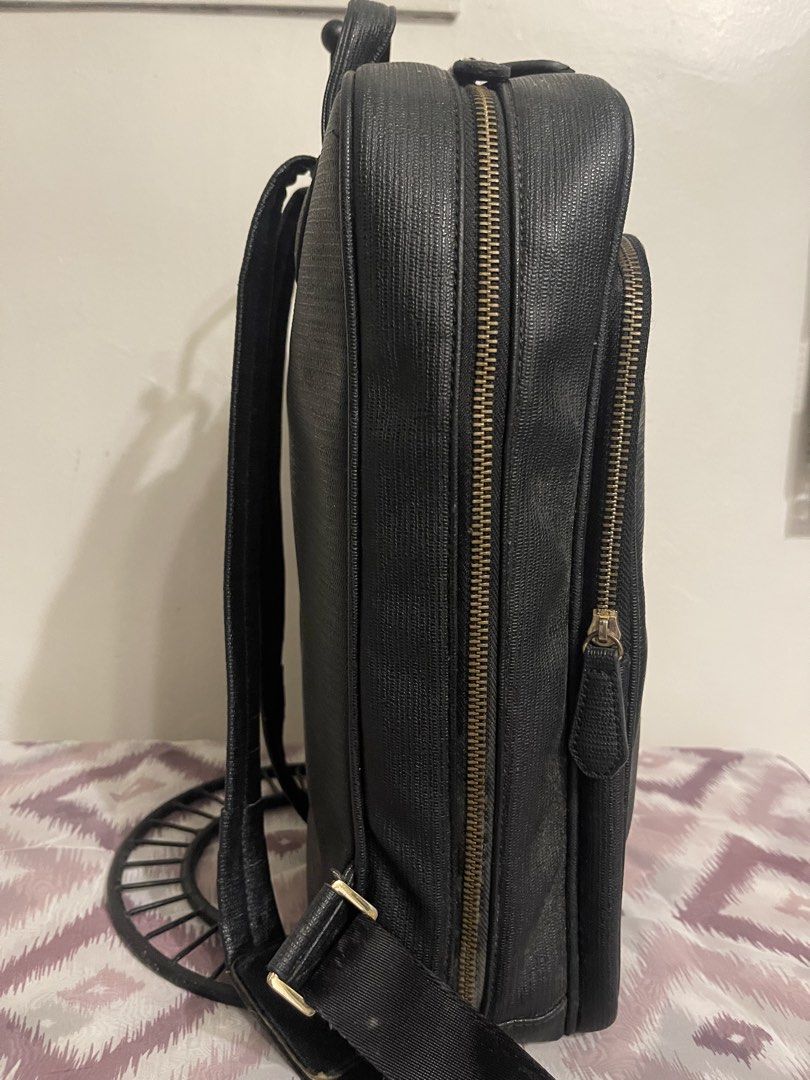 Pierre Cardin Black Textured Backpack (Category: Backpacks) located in General Trias. Submitted by laconchita_tesoros (Listing ID 1462947827, Image 3). Description: - Brand: Pierre Cardin - Color: Black - Material: Textured - Features: Main zippered compartment, front zippered pocket, adjustable shoulder straps, top handle - Ideal for: Daily use, travel Signs of used on zipper handle.