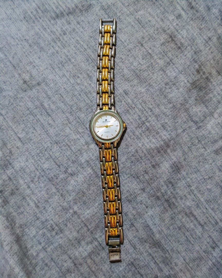 Pierre Cardin Quartz Two-Tone Watch (Category: Women's Watches) located in Taguig. Submitted by mystuff4youph (Listing ID 1463043316, Image 1). Description: - Brand: Pierre Cardin - Type: Quartz Watch - Strap: Two-tone metal (silver and gold) - Watch Face: White with gold hands and markers - Design: Classic, versatile style - Condition: Works well no issue no flaw - Reason for Selling: No longer worn - Battery working.