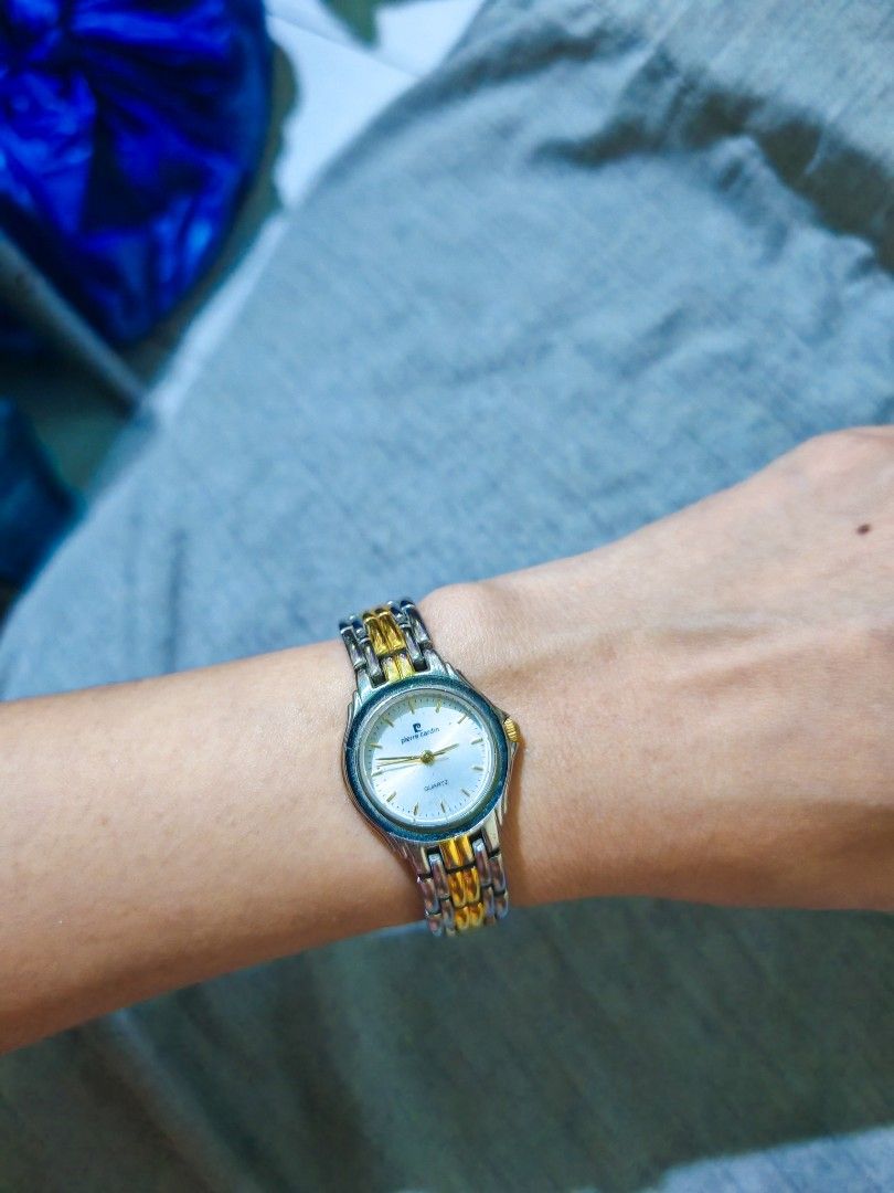 Pierre Cardin Quartz Two-Tone Watch (Category: Women's Watches) located in Taguig. Submitted by mystuff4youph (Listing ID 1463043316, Image 3). Description: - Brand: Pierre Cardin - Type: Quartz Watch - Strap: Two-tone metal (silver and gold) - Watch Face: White with gold hands and markers - Design: Classic, versatile style - Condition: Works well no issue no flaw - Reason for Selling: No longer worn - Battery working.