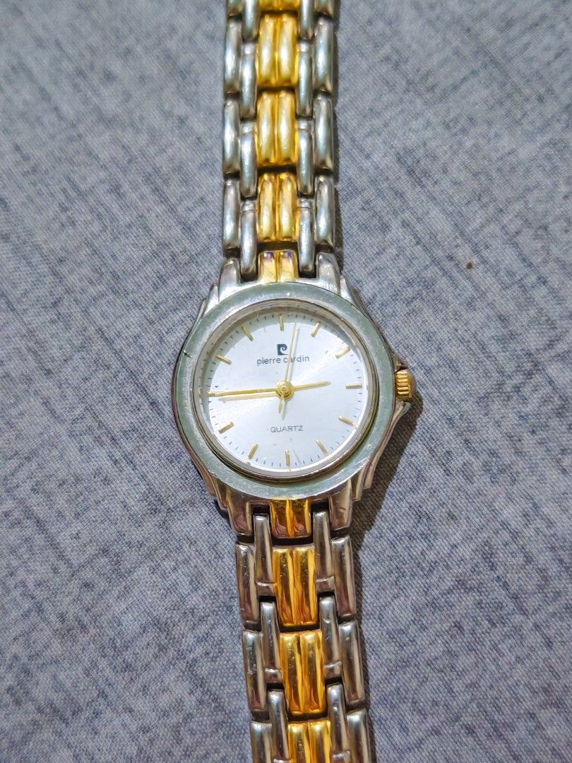 Pierre Cardin Quartz Two-Tone Watch (Category: Women's Watches) located in Taguig. Submitted by mystuff4youph (Listing ID 1463043316, Image 2). Description: - Brand: Pierre Cardin - Type: Quartz Watch - Strap: Two-tone metal (silver and gold) - Watch Face: White with gold hands and markers - Design: Classic, versatile style - Condition: Works well no issue no flaw - Reason for Selling: No longer worn - Battery working.
