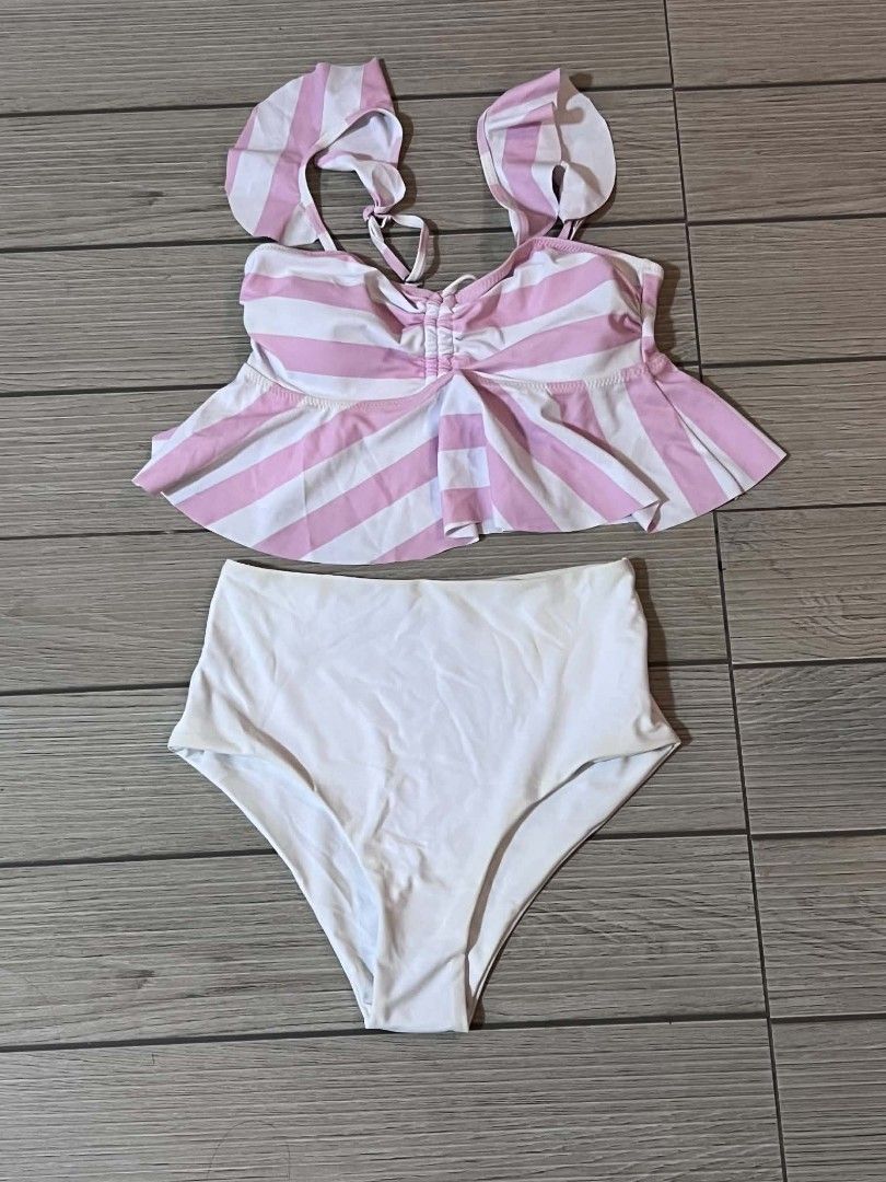 Pink and White Striped Ruffle Bikini Set (Category: Bikinis & Swimsuits) located in San Jose del Monte. Submitted by Skin_Care2022 (Listing ID 1463031389, Image 2). Description: - Adorable pink and white striped bikini set - Flattering high-waisted bottoms - Trendy ruffle details on the top - Ideal for beach or pool outings - Comfortable and stylish for summer fun Nastock lang.