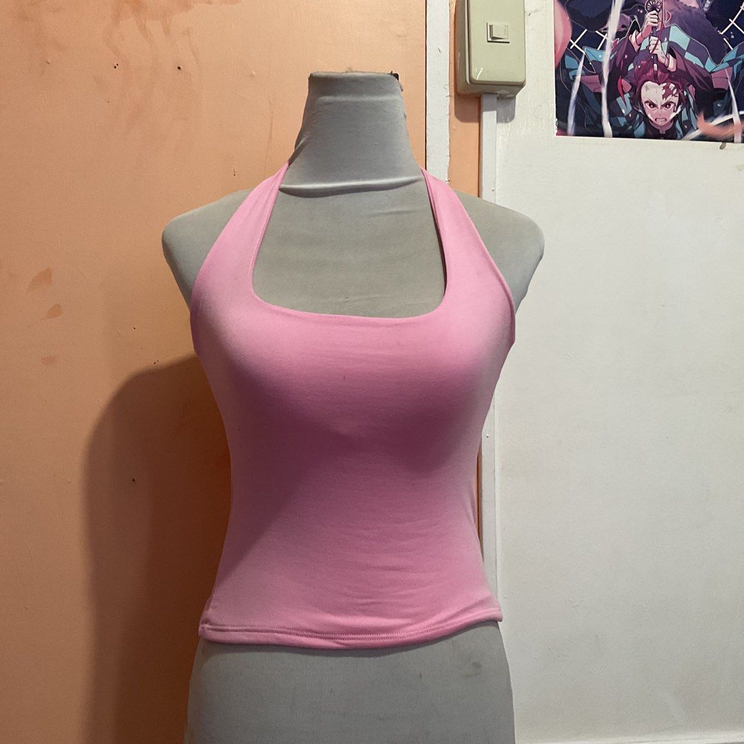 Pink Halter Neck Crop Top (Category: Sleeveless) located in Naga. Submitted by asrid.32 (Listing ID 1462950660, Image 1). Description: - Cute pink halter neck crop top - Stretchy material for a snug fit - Ideal for casual wear or dressing up - Easily pairs with jeans or skirts - Versatile for wearing alone or layering.