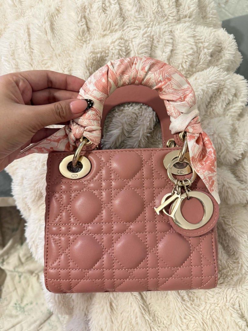 Pink Lady Dior Bag with Scarf (Category: Luxury Bags & Wallets) located in Cavite. Submitted by zacharyyy__ (Listing ID 1462966531, Image 1). Description: - Authentic Dior Lady Dior Bag - Color: Dusty Rose - Hardware: Gold - Iconic Cannage Stitching - Includes a cute scarf tied to the handle - Timeless and classic piece - comes with twilly - no issues - can ask more photos for sure buyer 3k only 📍gma cavite Can lalamove around nearby areas.