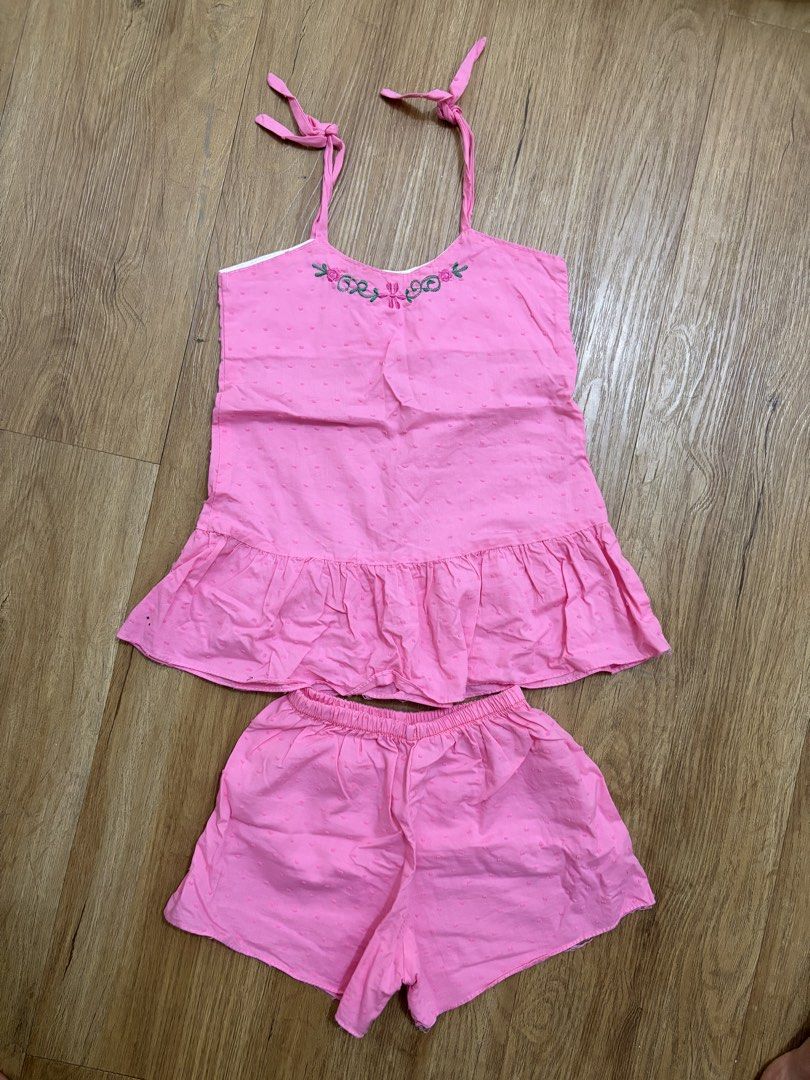 Pink Set with Floral Embroidery (Category: Babies & Kids Fashion) located in Taguig. Submitted by Shamieeee (Listing ID 1463072774, Image 2). Description: - Adorable pink pajama set made of soft, textured cotton. - Top features adjustable tie straps and a cute ruffled hem. - Shorts have a comfortable elastic waistband. - Delicate embroidered floral design on the top. - Please note: there are a couple of small dark marks on the fabric, clearly sho