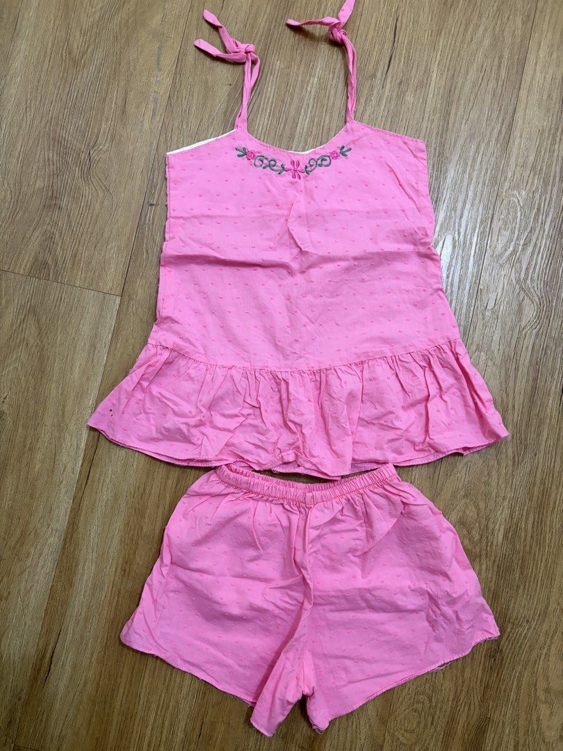Pink Set with Floral Embroidery (Category: Babies & Kids Fashion) located in Taguig. Submitted by Shamieeee (Listing ID 1463072774, Image 1). Description: - Adorable pink pajama set made of soft, textured cotton. - Top features adjustable tie straps and a cute ruffled hem. - Shorts have a comfortable elastic waistband. - Delicate embroidered floral design on the top. - Please note: there are a couple of small dark marks on the fabric, clearly sho