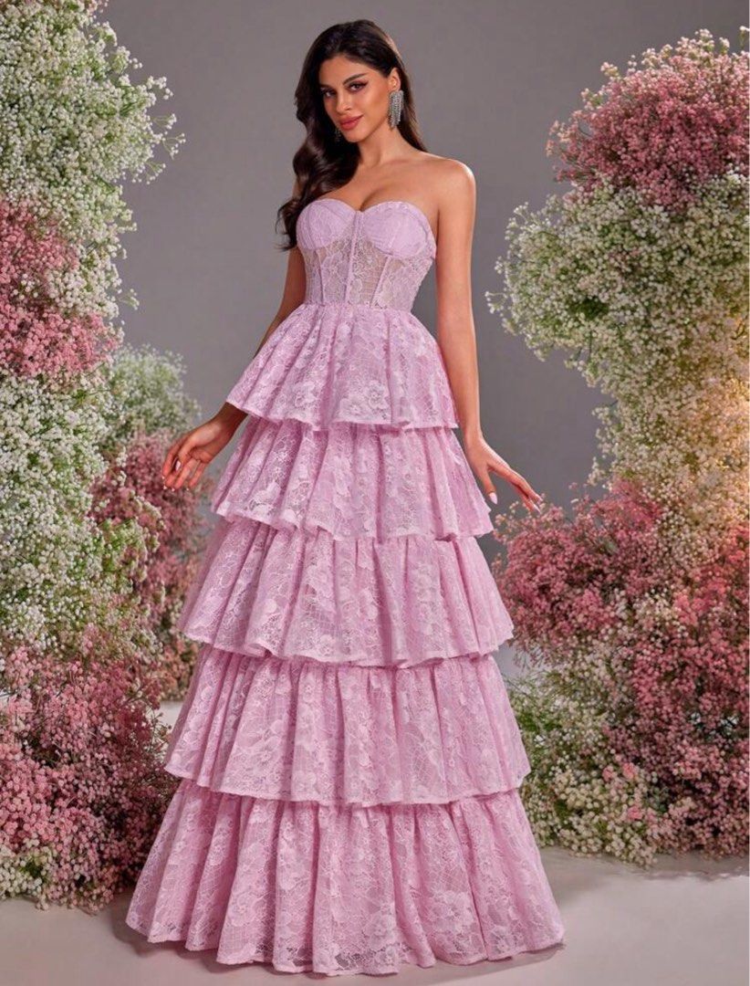 Pink Tiered Lace Strapless Gown (Category: Evening dresses & gowns) located in Pasig City. Submitted by lai028 (Listing ID 1462897450, Image 3). Description: - used once for an event, superrr pretty in actual. Eye catching, perf sa mga garden wedding events Beautiful pink tiered lace gown - Strapless design with corset-style bodice - Full, layered skirt - Intricate lace pattern for a delicate touch - Lace-up closure at the back for a custom fit -