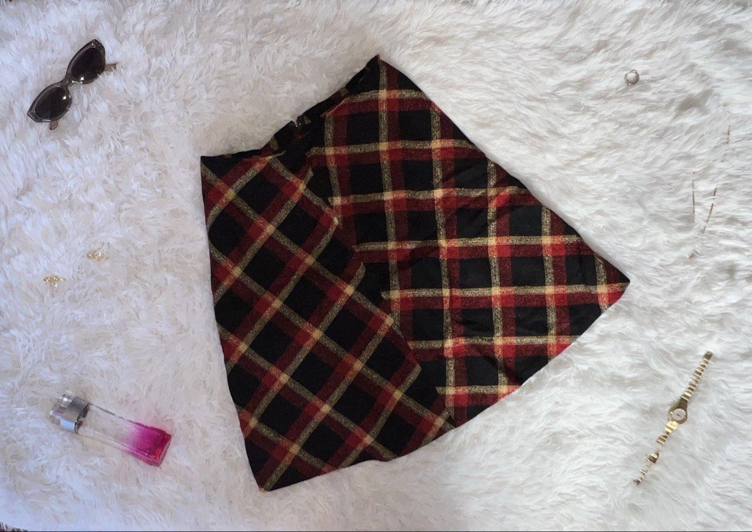 Plaid Mini Skirt with Gold Threading (Category: Skirts) located in Tuguegarao City. Submitted by love_clothies (Listing ID 1462898824, Image 1). Description: - Black mini skirt - Red and gold plaid pattern with subtle gold shimmer - Back zipper closure - Ideal for night outs or festive occasions - Pairs well with boots or heels.