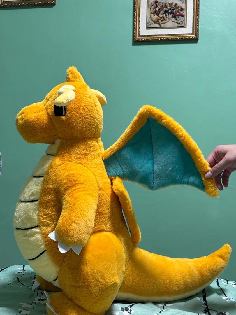 Pokemon Dragonite Plush Toy (Category: Plushies & Soft Toys) located in Quezon City. Submitted by abc2xxx (Listing ID 1462976456, Image 2). Description: - Big Dragonite plush toy - Classic orange and cream colors - Features striking blue wings - Ideal for any Pokemon enthusiast - Great for display or cuddling - Super soft and huggable material - Ready to find its new home! Quezon City.