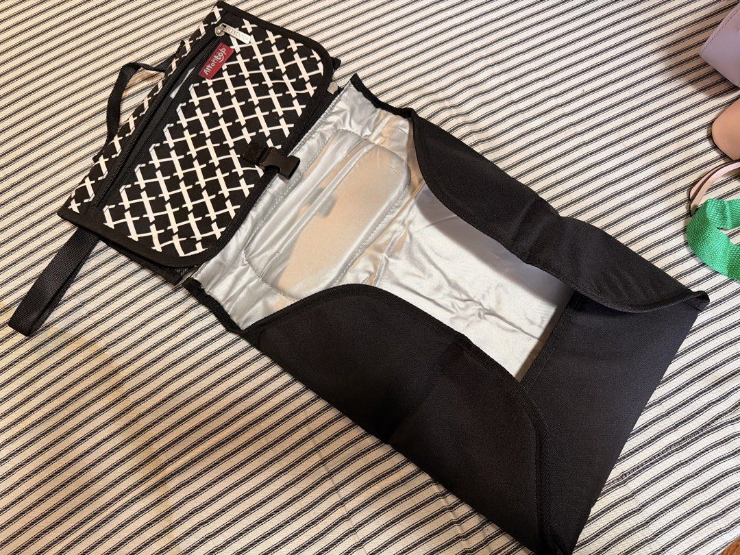 Portable diaper changing pad (Category: Other Baby Bathing & Changing Needs) located in Manila. Submitted by mondaymom (Listing ID 1462986068, Image 2). Description: Travel Changing Pad for babies - Has wipes compartment and other pockets - includes wrist strap for easy carry Freebies: Tiny Buds small back pack and Chuckie bag.