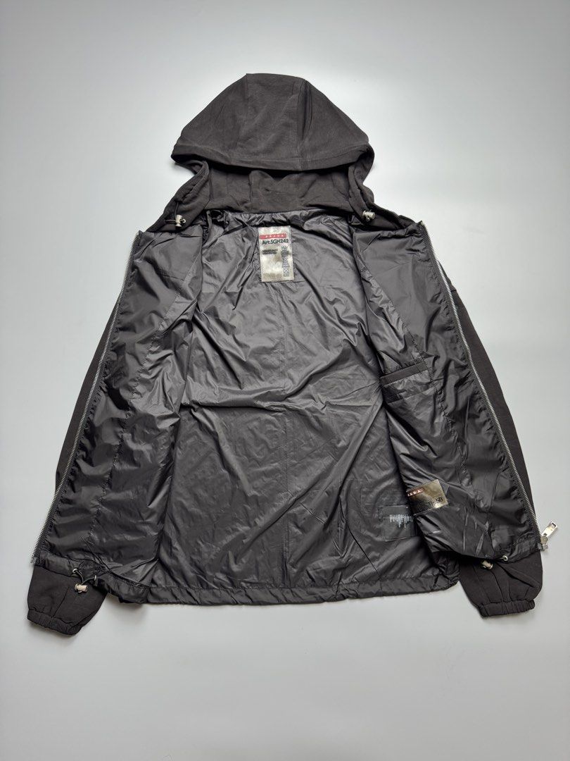 Prada - Nylon Hoodie Zip up Jacket (Category: Luxury Apparel) located in Quezon City. Submitted by japon_rose (Listing ID 1462905999, Image 3). Description: READ DESCRIPTION FIRST BEFORE YOU START A DEAL GUARANTEED AUTHENTIC ❗️ Unisex/ Prada - Nylon Hoodie Zip up Jacket Color: Black Size: Medium on tag (Unisex) Length: 26 Width: 21 Shoulder: 17 Sleeves: 26 Hem: 20 (Adjustable string) (MEASURED IT BY INCHES) 9.5/10 overall condition In excellent c