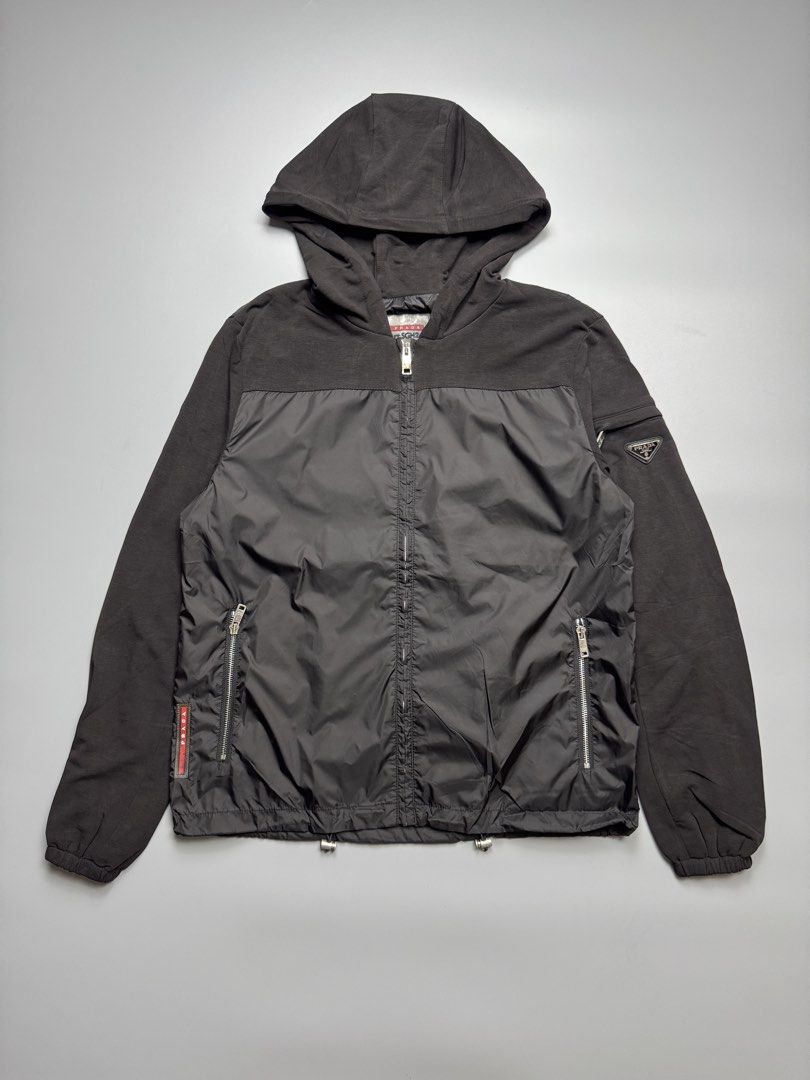 Prada - Nylon Hoodie Zip up Jacket (Category: Luxury Apparel) located in Quezon City. Submitted by japon_rose (Listing ID 1462905999, Image 1). Description: READ DESCRIPTION FIRST BEFORE YOU START A DEAL GUARANTEED AUTHENTIC ❗️ Unisex/ Prada - Nylon Hoodie Zip up Jacket Color: Black Size: Medium on tag (Unisex) Length: 26 Width: 21 Shoulder: 17 Sleeves: 26 Hem: 20 (Adjustable string) (MEASURED IT BY INCHES) 9.5/10 overall condition In excellent c