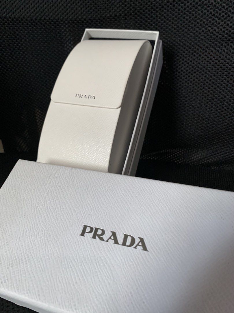 PRADA Acetate Symbole Sunglasses (Category: Sunglasses & Eyewear) located in Paranaque City. Submitted by totiiiii (Listing ID 1462969805, Image 2). Description: PRADA Acetate Symbole Sunglasses - Guaranteed original - Rectangular frame style - Comes with original Prada box and case - Includes bag, authenticity card, and instruction booklet Perfect accessory for any outfit. Price is slightly negotiable. DM if interested..