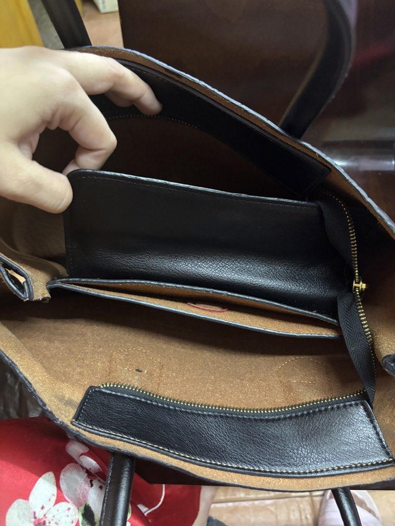 Prada Black Croc Embossed Leather Tote Bag (Category: Luxury Bags & Wallets) located in Manila. Submitted by robbyrabbit (Listing ID 1462915045, Image 3). Description: - Genuine black leather tote bag - Elegant croc-embossed texture - Iconic gold Prada logo on the front - Secure top zipper closure - Spacious interior with multiple compartments - Interior zippered pocket for valuables - Four protective gold studs on the bottom - Sturdy and comfort