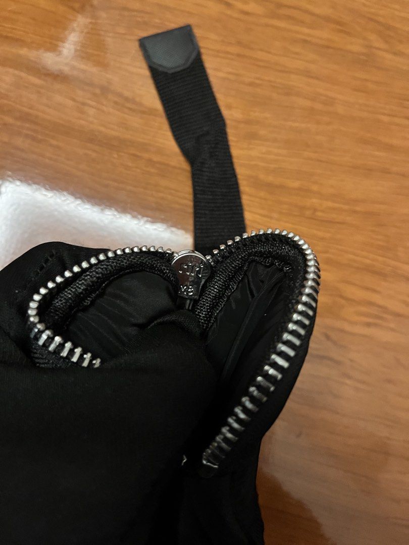 Prada Black Pleated Skirt with Pouch (Category: Skirts) located in Calasiao. Submitted by cristinabarongan5 (Listing ID 1462955446, Image 2). Description: - Authentic Prada black pleated skirt - Includes a detachable pouch with zipper closure - Adjustable strap for versatile wear - Features a small Prada logo on the skirt side - Pouch also displays the iconic Prada logo - Ideal for both casual outings and evening events - Size 26-27 - Inches 16.