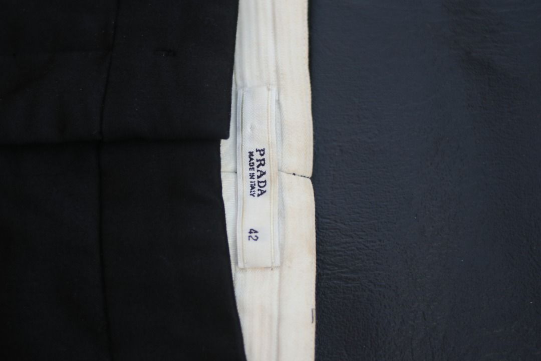 Prada Black Tailored Trousers Size 42 (Category: Trousers) located in Taguig. Submitted by kurim4w (Listing ID 1463011283, Image 2). Description: - Authentic Prada Trousers - Made in Italy - Size: 42 on tag - Features zip closure - Subtle zip detail at the hem - Classic tailored fit - Please check photos for condition details 32 waist 34 length 7leg opening 2499php plus sf only taguig city location.