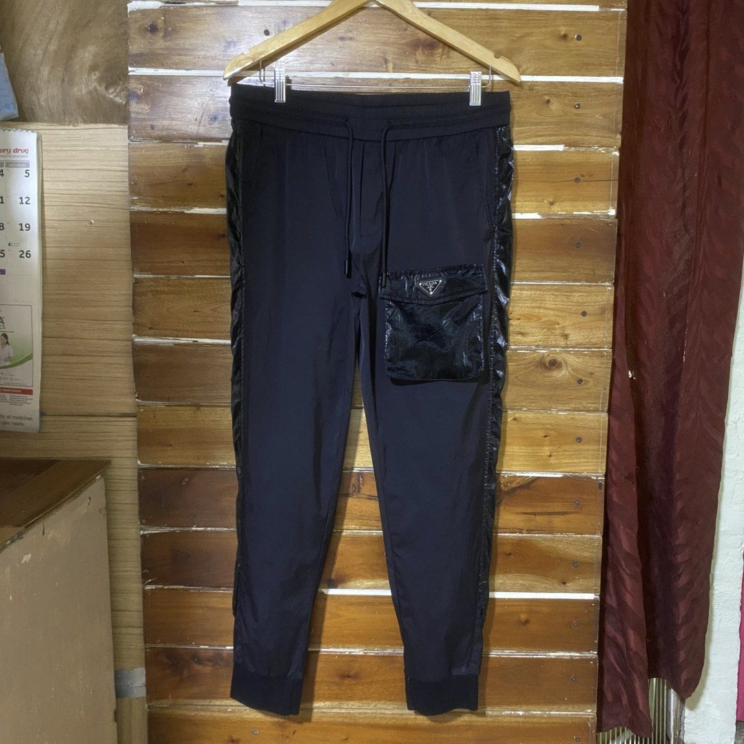 Prada Nylon Pocket Pants (Category: Joggers) located in Manila. Submitted by aym_fortunate (Listing ID 1462947977, Image 1). Description: EXCELLENT CONDITION. DIMES. WAIST : 34 to 42 ( FREE SIZE ) LENGTH : 38 COLOR RATE / CONDITION : 10/10 .
