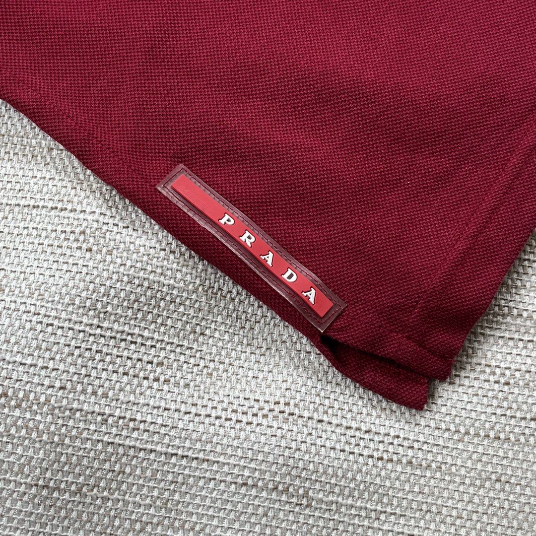 Prada Red Tab Polo Shirt (Category: Luxury Apparel) located in Panabo. Submitted by curated.dept (Listing ID 1462951985, Image 3). Description: size medium 20 width, 26 length excellent condition 9/10 color rate flawless/no issues free shipping.