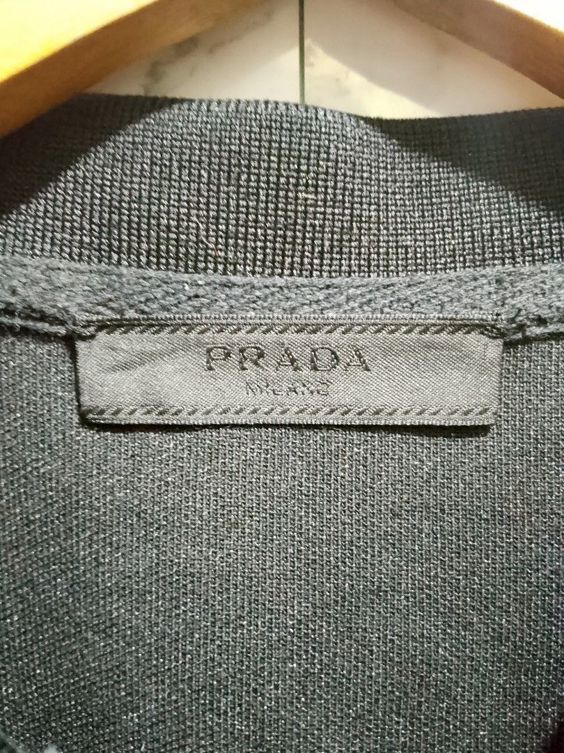 Prada Rubberized Logo Polo (Category: Tshirts & Polo Shirts ) located in Paranaque City. Submitted by lanceee.999 (Listing ID 1462939522, Image 3). Description: Size: M-L Fitting Dimes: W20.5 L27.5 Complete Tags Off/Authentic No Issue Color Rate: 7.5/10 Good Condition.