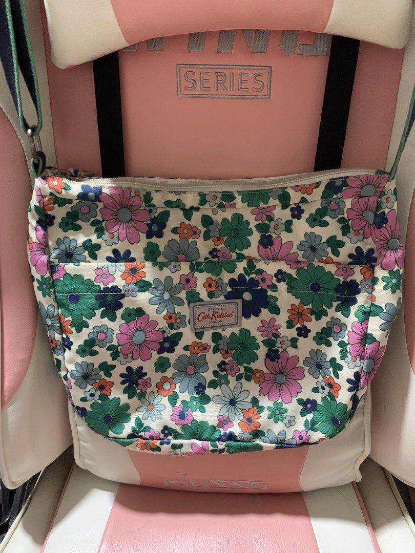 Preloved Cath Kidston sling bag (Category: Cross-body Bags) located in General Trias. Submitted by vpshoppe (Listing ID 1463053293, Image 1). Description: Preoved Cath Kidston sling bag floral design used but not abused with minimal stains inside the bag pls see photos for decluttering.