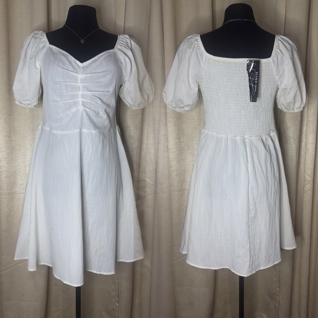 Puffsleeves Dress (Category: Dresses) located in Cainta. Submitted by vestito_bestida (Listing ID 1462915256, Image 2). Description: ⛔️ACTUAL PHOTO POSTED⛔️ 👉 Brandnew 👉 Size: small to medium 👉 Length: 34" 👉 cotton linen 👉 Flatlay measured using medida 👉 Actual photo posted. 👉 No filter. Colors may vary due to lightning and photo quality. - Cute white mini dress - Features puff sleeves - Ruched bodice - Smocked back for a comfortable fit -
