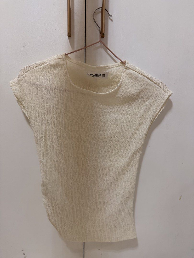 Pull & Bear Textured Cap Sleeve Top Cream M (Category: Blouses) located in Manila. Submitted by cruzjestel27461 (Listing ID 1463088090, Image 1). Description: - Cream colored cap sleeve top - Brand: Pull & Bear - Textured fabric all over - Short sleeves with raw edge hem - Round neckline - Ideal for casual wear ONLY WORN ONCE.