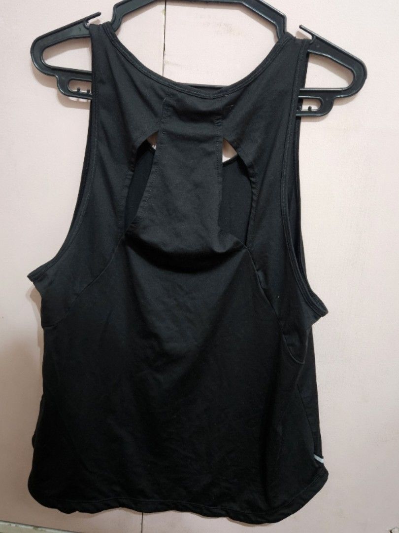 Puma Black Athletic Tank Top (Category: Activewear) located in Quezon City. Submitted by jeannego (Listing ID 1462952266, Image 2). Description: - Black Puma tank top - Racerback design with stylish back cutouts - Ideal for workouts or casual wear - Made with lightweight and breathable material - Features the iconic Puma logo on the front.