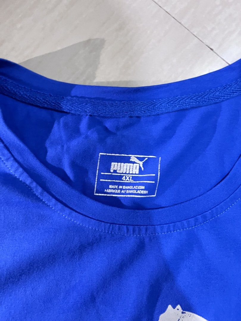 Puma Blue T-shirt 4XL (Category: Tshirts & Polo Shirts ) located in Binan City. Submitted by huntwear_.turtle (Listing ID 1463001991, Image 2). Description: - Blue Puma T-shirt - Size: 4XL - Features classic Puma logo on the front - Material: Cotton blend - Ideal for casual wear.