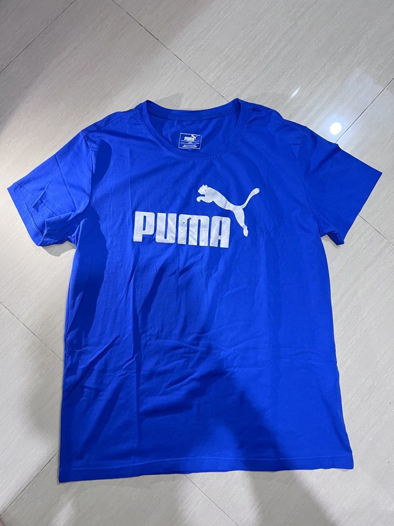 Puma Blue T-shirt 4XL (Category: Tshirts & Polo Shirts ) located in Binan City. Submitted by huntwear_.turtle (Listing ID 1463001991, Image 1). Description: - Blue Puma T-shirt - Size: 4XL - Features classic Puma logo on the front - Material: Cotton blend - Ideal for casual wear.