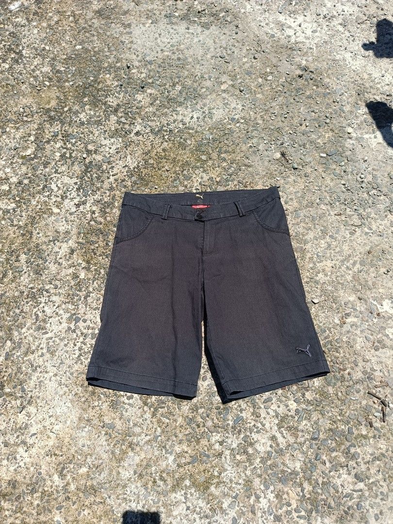 Puma Men's Casual Shorts (Category: Shorts) located in Urdaneta. Submitted by tetsudoubletaps (Listing ID 1462918966, Image 1). Description: 30 - 32 + SF - Brand: Puma - Color: Dark Grey - Material: 97% Nylon, 3% Elastane - Features: Embroidered Puma logo on left leg, 2 front pockets, 2 back pockets - Closure: Button and zip - Ideal for: Everyday wear, light sports.