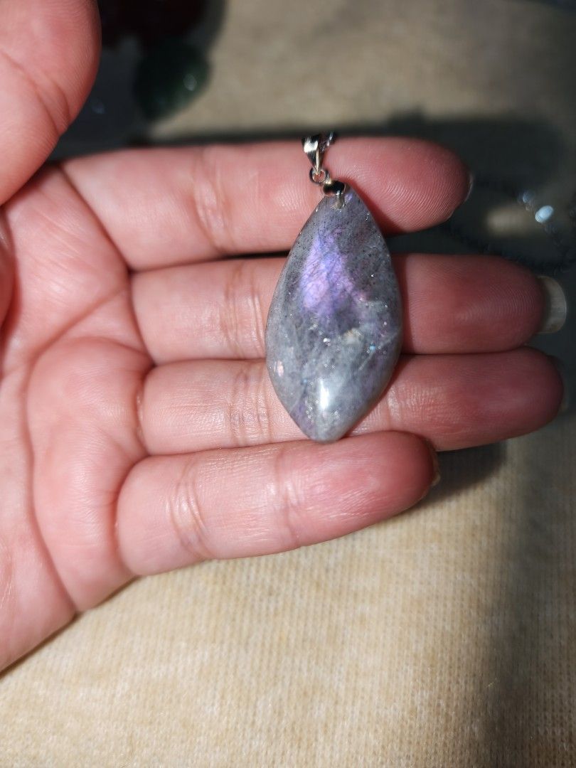 Purple Labradorite Pendant (Category: Necklaces) located in Quezon City. Submitted by piaoliangcollections.ph (Listing ID 1463096691, Image 1). Description: Made From Natural Labradorite Stone. Key Benefits and Properties Aura Protection: Acts as a shield against negative energy and prevents emotional drain, making it useful for empaths. Intuition Boost: Connected to the third eye chakra to sharpen inner vision, psychic abilities, and clear decis