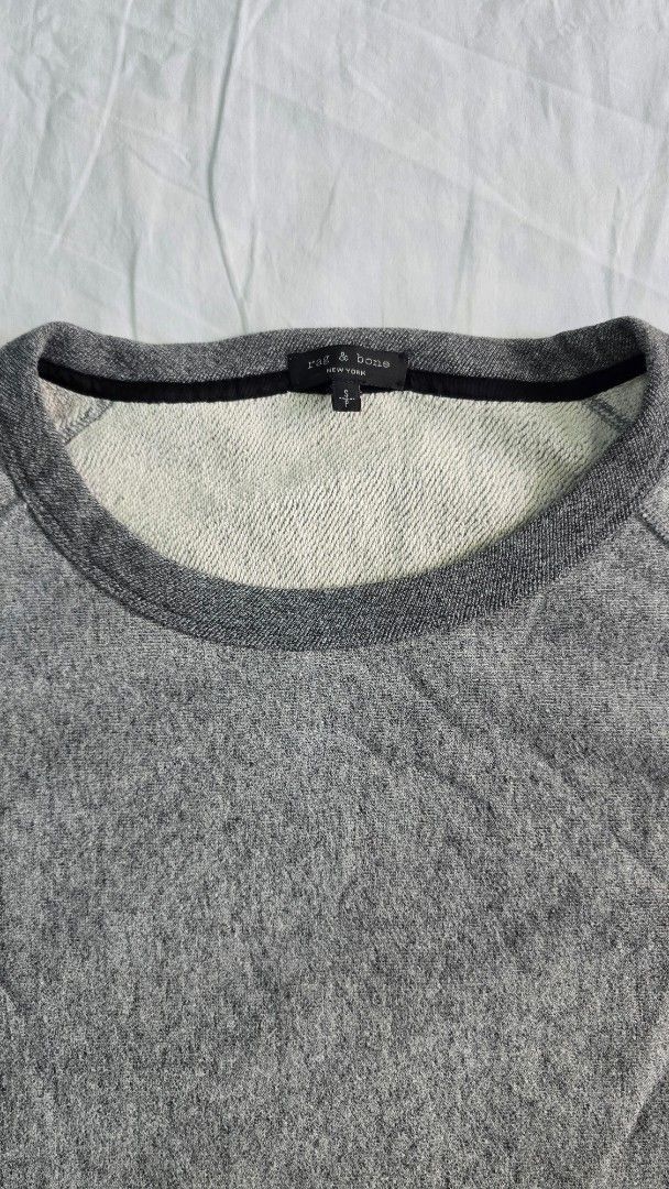 Rag & Bone Grey Melange Crewneck Sweatshirt (Category: Coats, Jackets and Outerwear) located in Santa Rosa. Submitted by hangrycryp53334 (Listing ID 1462929467, Image 3). Description: - Brand: Rag & Bone - Color: Grey Melange - Style: Crewneck Sweatshirt - Features: Ribbed cuffs and hem - Material: Soft fabric for comfort, Heavy cloth - Size: Tagged S (measurements in photos) - Condition: Great staple piece - Oversized fit Issue: Slight yellowing