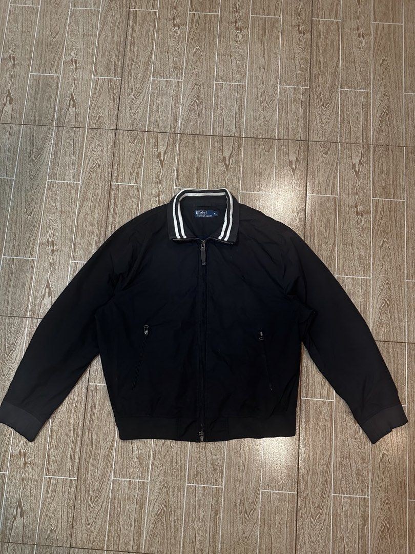 Ralph lauren nylon tracker jacket (Category: Coats, Jackets and Outerwear) located in Taytay. Submitted by rthriftshoppp (Listing ID 1463031547, Image 1). Description: - Brand: Ralph Lauren - Type: Nylon Tracker Jacket - Color: Black - Size: XL - Features: Embroidered logo, striped collar detail, lightweight nylon material - Style: Sporty, casual, classic Ralph lauren trucker jacket Black Size XL 25 W 27 L 9/10 color rate Issue minimal washable s