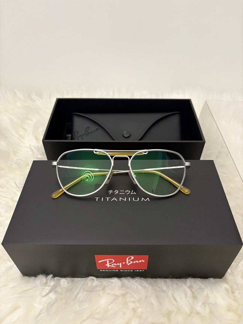 Ray-Ban Titanium Aviator Eyeglasses (Category: Sunglasses & Eyewear) located in Quezon City. Submitted by AAAAAF14 (Listing ID 1463085474, Image 1). Description: bought for 27k - Authentic Ray-Ban eyeglasses - Model: RX6389 - Material: Lightweight Titanium - Frame Color: Silver with Yellow Temple Tips - Lens Width: 50mm - Bridge Width: 19mm - Includes original Ray-Ban case and box.