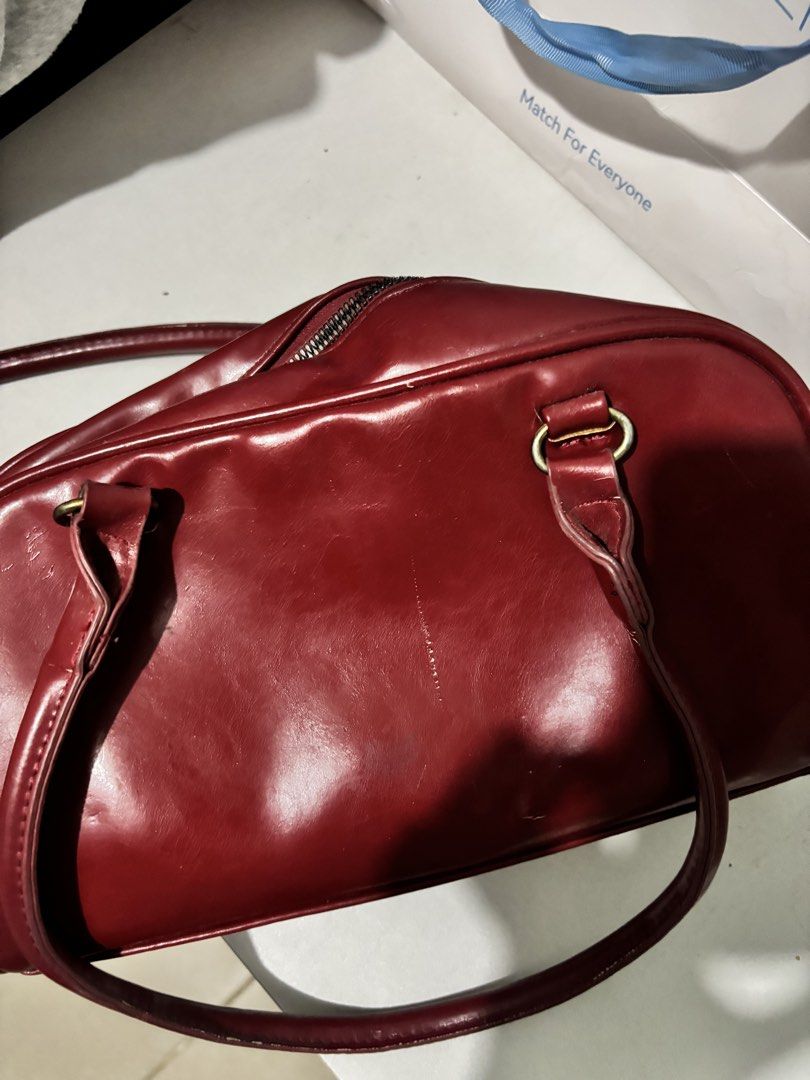 red bag with two pockets on front (Category: Shoulder Bags) located in Manila. Submitted by iyahpreloved_ (Listing ID 1463020677, Image 2). Description: red bag has sign of usage still nego! .