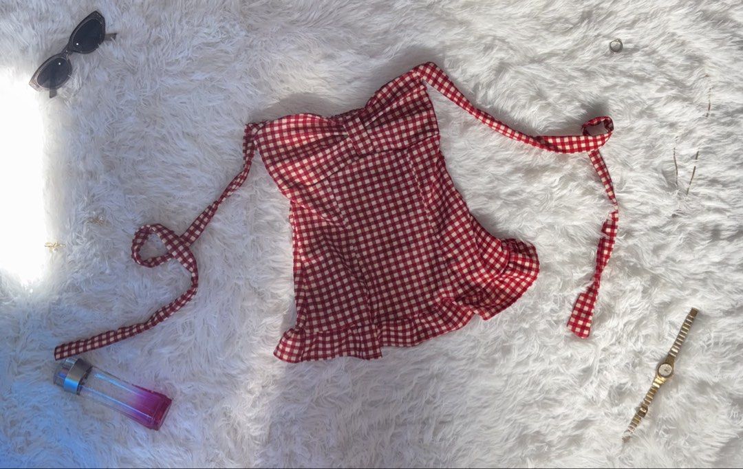 Red Gingham Off-Shoulder Top with Tie Straps (Category: Blouses) located in Tuguegarao City. Submitted by love_clothies (Listing ID 1462903637, Image 1). Description: - Adorable red gingham pattern - Trendy off-shoulder design - Adjustable tie straps - Flirty ruffled hem - Best fits size Small to Medium - Ideal for picnics, casual outings, or a day at the park - Versatile: pair with jeans or shorts.