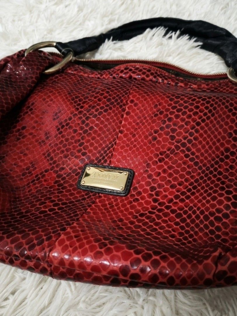 Red Snake Print Shoulder Bag (Category: Shoulder Bags) located in Manila. Submitted by cheezynutzyfriez (Listing ID 1462976974, Image 2). Description: - Cute red shoulder bag - Unique snake print texture - Black straps and gold hardware - Small gold logo plate on the front - Perfect size for essentials - Great for nights out or adding a pop of color.