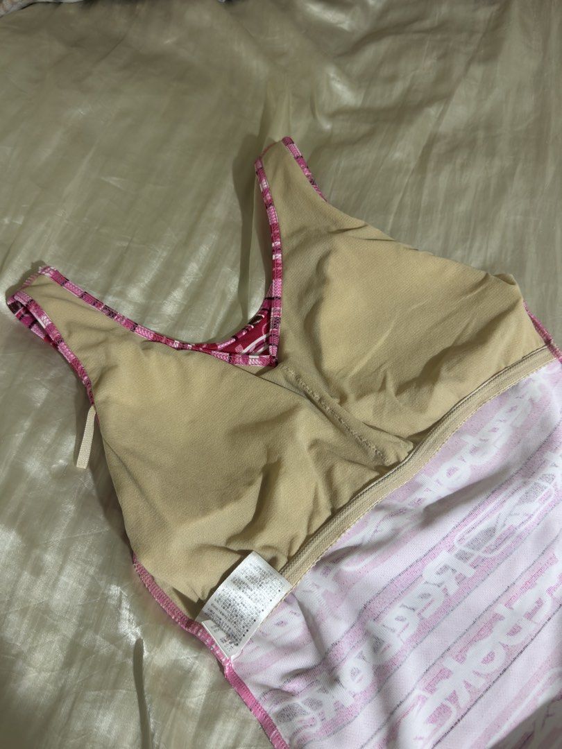 Reebok Pink Striped Tank Top (Category: Sleeveless) located in Legazpi City. Submitted by bouxloset (Listing ID 1463051215, Image 2). Description: - Cute pink and white striped Reebok tank top - All-over Reebok logo print - V-neck with racerback straps - Built-in bra lining for support - Ideal for workouts or casual wear.