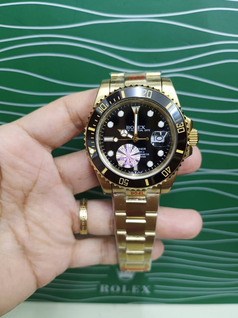 Rolex Submariner Automatic Watch - Green Bezel (Category: Luxury Watches) located in Manila. Submitted by chaionlineshop (Listing ID 1462998258, Image 2). Description: - Rolex Submariner - Automatic movement - Green bezel and dial - Two-tone stainless steel and gold band - Includes original box and papers - Excellent addition to any watch collection - Message for inquiries.