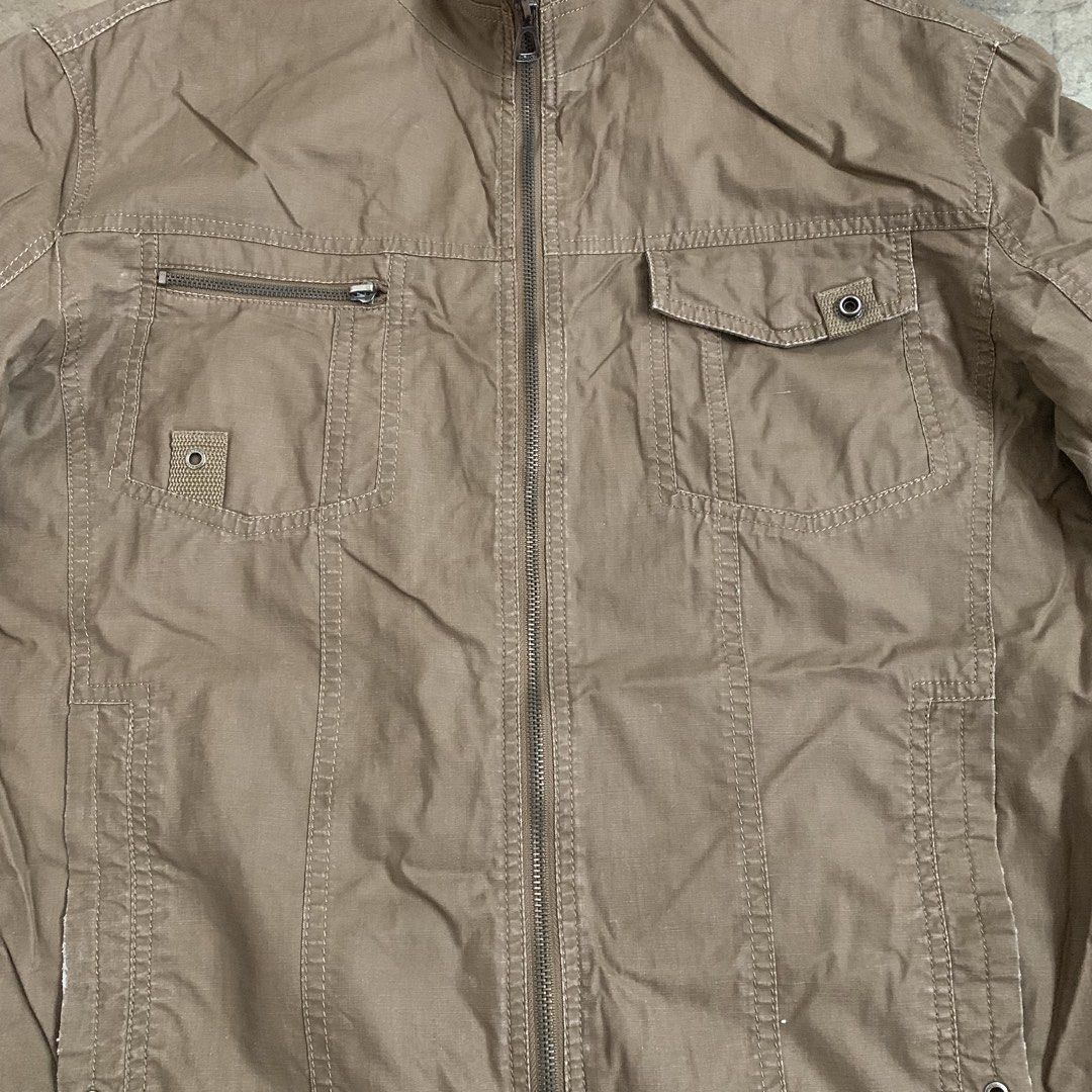 ROMON Classic Design Quality Khaki Jacket XL (Category: Coats, Jackets and Outerwear) located in Manila. Submitted by thriftnivee (Listing ID 1463031708, Image 2). Description: - ROMON Khaki Jacket - Classic design with quality construction - Zip-up front - Multiple pockets, including a zippered chest pocket - Ribbed collar detail - Size XL - Great for casual wear.