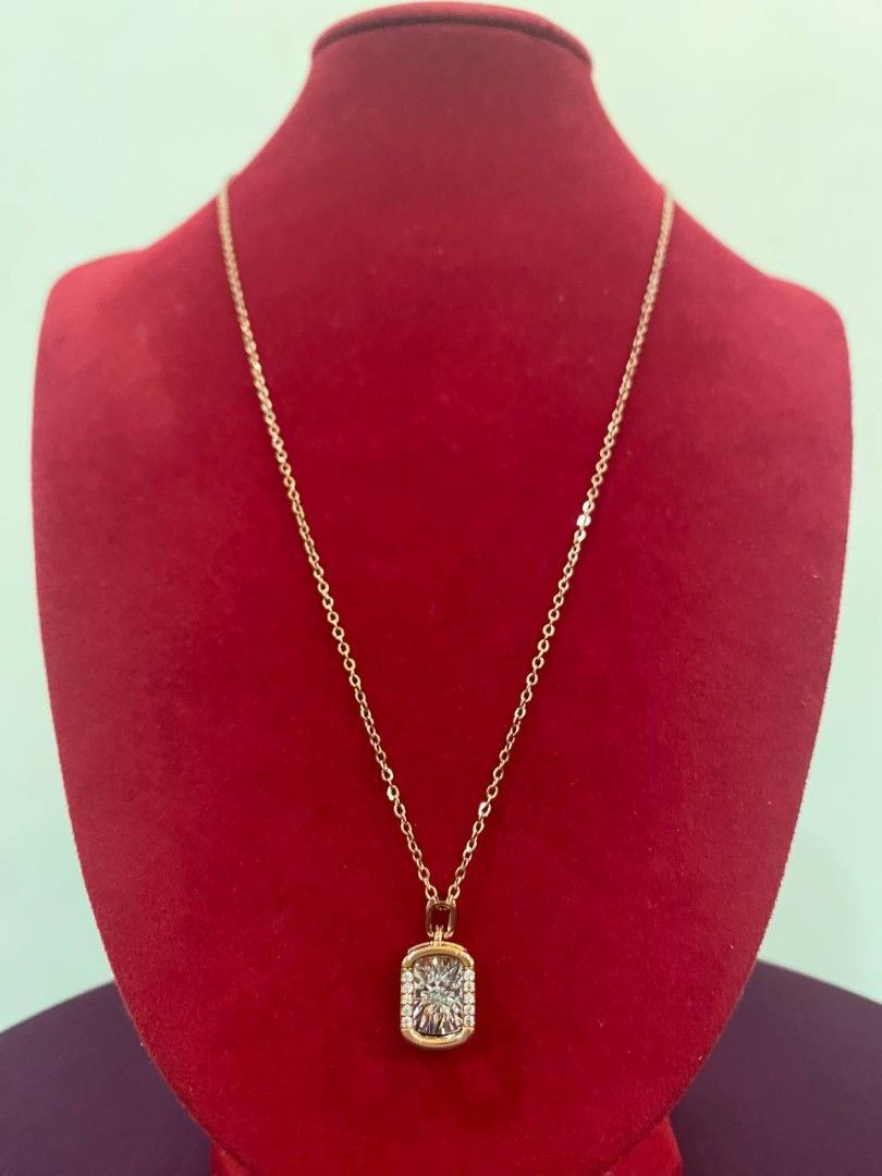 Rosegold toned Rectangular Shape pendant Necklace (Category: Necklaces) located in Banga. Submitted by amorxa (Listing ID 1462939151, Image 1). Description: A delicate rose gold necklace featuring a rectangular or cushion-shaped halo pendant with a sparkling center stone..