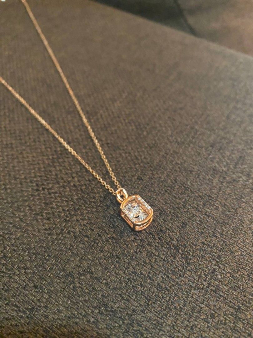 Rosegold toned Rectangular Shape pendant Necklace (Category: Necklaces) located in Banga. Submitted by amorxa (Listing ID 1462939151, Image 3). Description: A delicate rose gold necklace featuring a rectangular or cushion-shaped halo pendant with a sparkling center stone..
