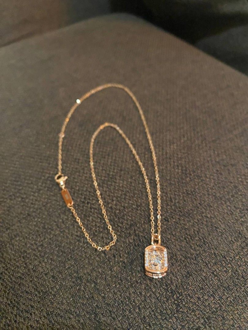 Rosegold toned Rectangular Shape pendant Necklace (Category: Necklaces) located in Banga. Submitted by amorxa (Listing ID 1462939151, Image 2). Description: A delicate rose gold necklace featuring a rectangular or cushion-shaped halo pendant with a sparkling center stone..