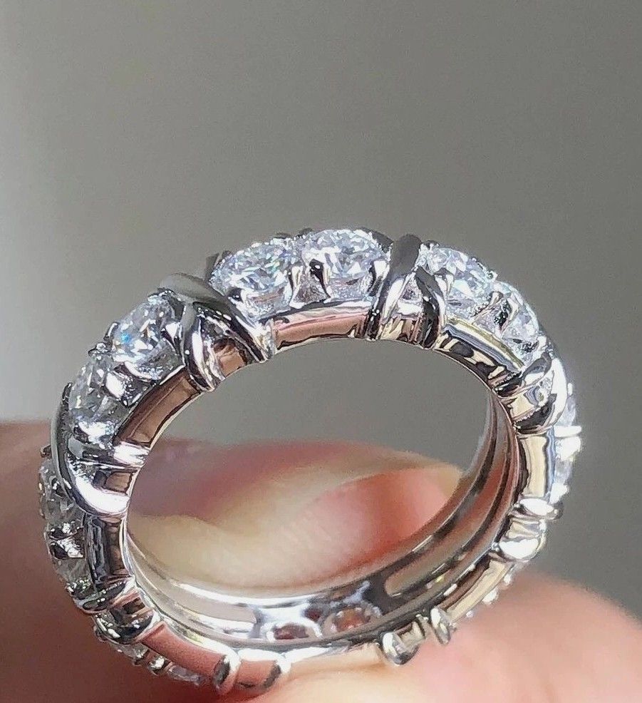 Round Cut Moissanite Full Eternity (Category: Rings) located in Mandaluyong City. Submitted by light36 (Listing ID 1463018084, Image 2). Description: - Beautiful diamond band ring - Features multiple round-cut diamonds - Set in lustrous white gold - Unique criss-cross wrap design around stones - Sparkles brilliantly under light - Ideal for stacking or wearing alone.