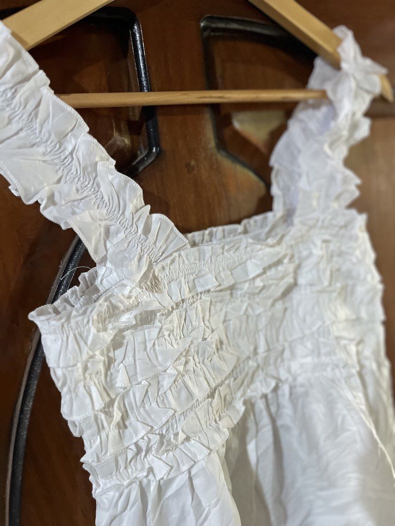 RUFFLED SHOULDER STRAP WHITE SMOCKED CROP-top (Category: Others Tops) located in Manila. Submitted by dinielajean.com (Listing ID 1463009719, Image 2). Description: ❗️RUFFLED SHOULDER STRAP WHITE SMOCKED CROP-top RANDOM S-M garterize THRIFT NOT PRELOVED😤 Color rate: 9.5/10🎉 Good as new✅ DM📥.