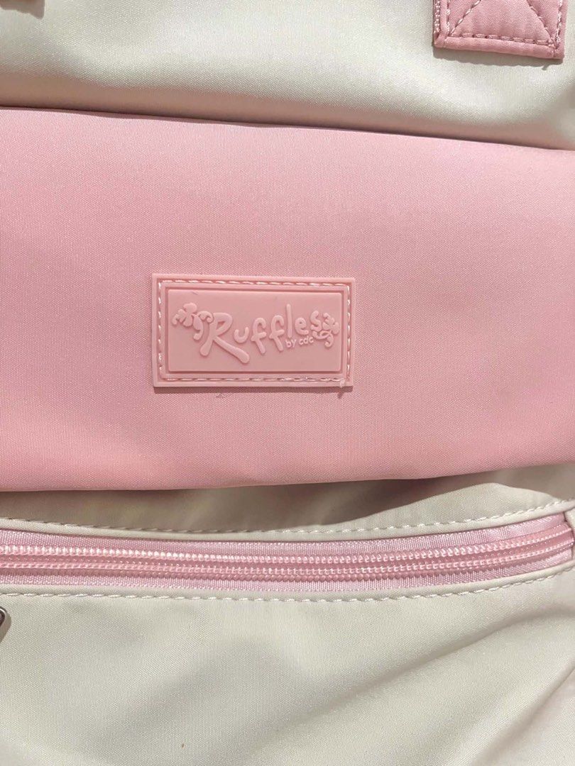 Ruffless by CDO Pink and Cream Backpack (Category: Backpacks) located in Manila. Submitted by swiftstorm.ace395 (Listing ID 1462900145, Image 2). Description: Cute pink and cream Ruffless by CDO backpack. Many pockets, zippers/velcro, adjustable straps. Perfect for school or daily use..