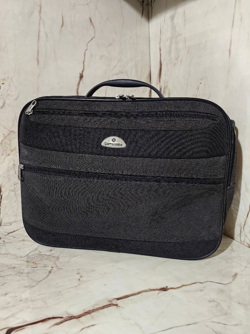 Samsonite Black Travel Bag Organizer (Category: Belt bags, Clutches and Pouches) located in Tarlac. Submitted by jeremiah.curator.2026 (Listing ID 1462890090, Image 1). Description: - Brand: Samsonite - Color: Black - Material: Textured fabric - Features: Top handle, multiple zippered compartments, side hanging loop - Benefits: Great for organizing travel essentials, compact and easy to pack - Ideal for: Short trips or everyday use.