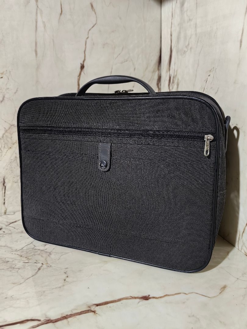 Samsonite Black Travel Bag Organizer (Category: Belt bags, Clutches and Pouches) located in Tarlac. Submitted by jeremiah.curator.2026 (Listing ID 1462890090, Image 3). Description: - Brand: Samsonite - Color: Black - Material: Textured fabric - Features: Top handle, multiple zippered compartments, side hanging loop - Benefits: Great for organizing travel essentials, compact and easy to pack - Ideal for: Short trips or everyday use.