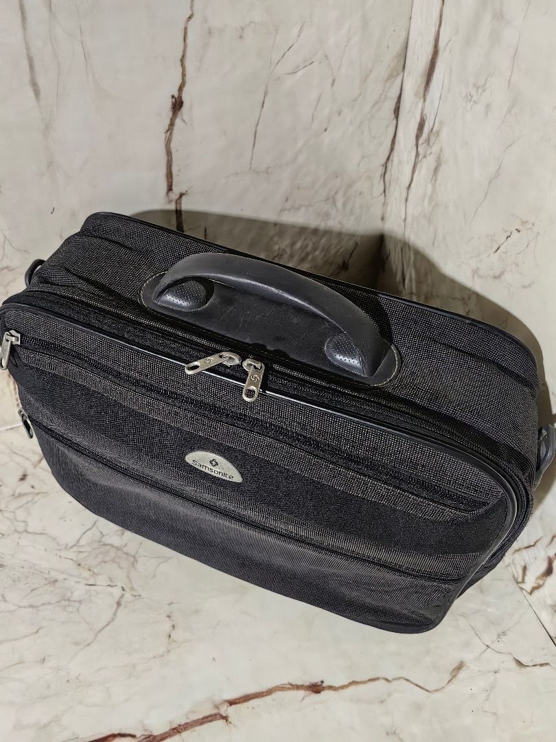 Samsonite Black Travel Bag Organizer (Category: Belt bags, Clutches and Pouches) located in Tarlac. Submitted by jeremiah.curator.2026 (Listing ID 1462890090, Image 2). Description: - Brand: Samsonite - Color: Black - Material: Textured fabric - Features: Top handle, multiple zippered compartments, side hanging loop - Benefits: Great for organizing travel essentials, compact and easy to pack - Ideal for: Short trips or everyday use.