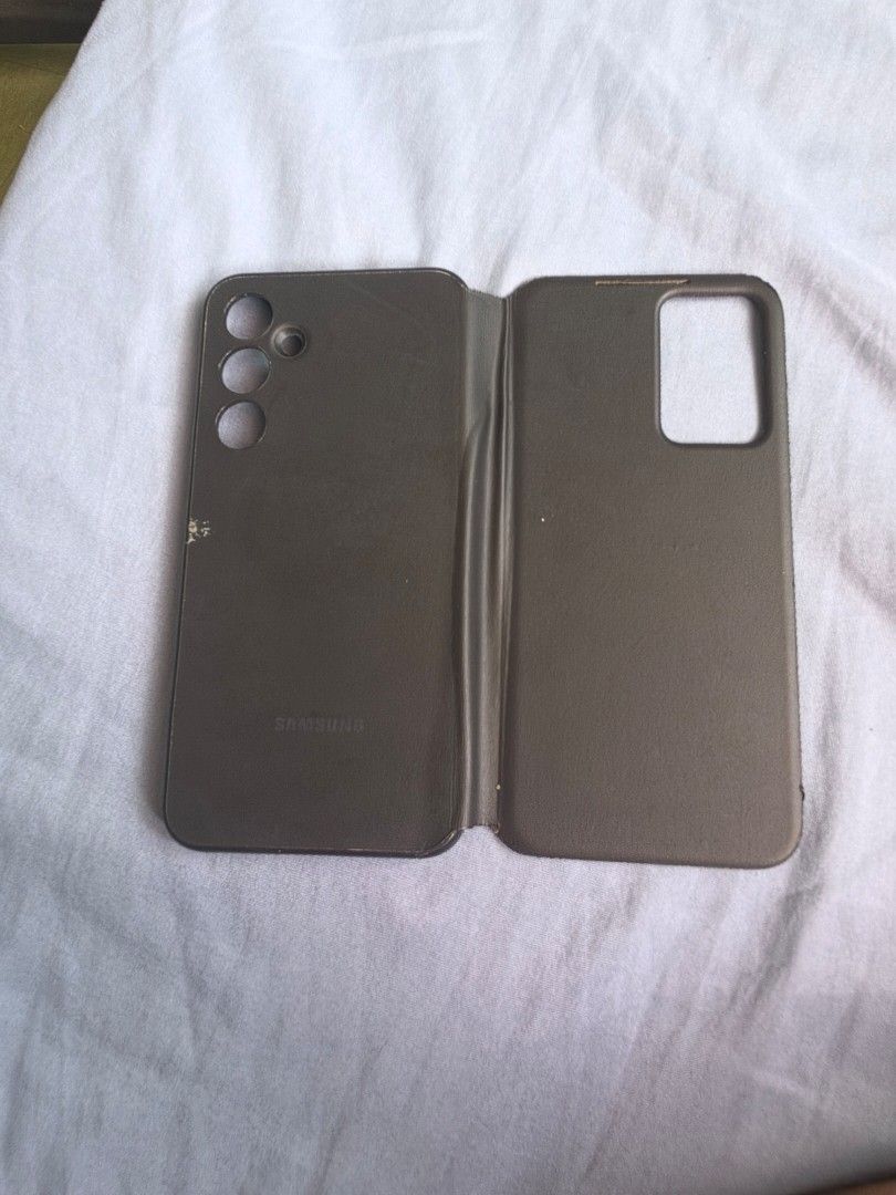 Samsung A55 5G Smart View Wallet Case (Category: Cases & Sleeves) located in San Mateo. Submitted by swoooopie (Listing ID 1462896826, Image 2). Description: - Genuine Samsung A55 5G Smart View Wallet Case - Flip cover design for full phone protection - Smart View window for quick notifications without opening the case - Interior lining to prevent scratches - Secure fit for Samsung A55 5G - Functional and stylish protection.